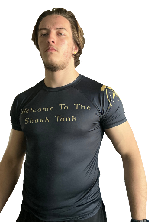 Black and gold "Welcome To The Shark Tank" tribal rash guard for grappling Hammerhead Grappling Wear